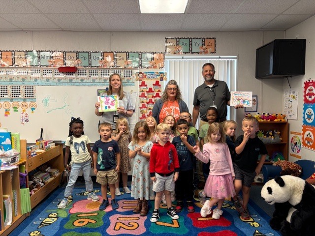VPK presents Big Books to Mr. K. and Mrs. Brooker.