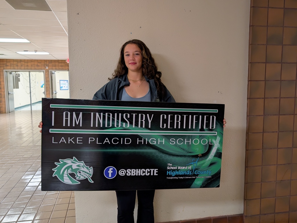 Students holding certificate.