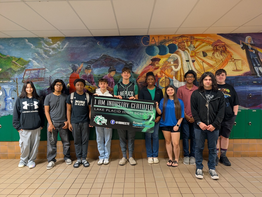 Students holding certificate.