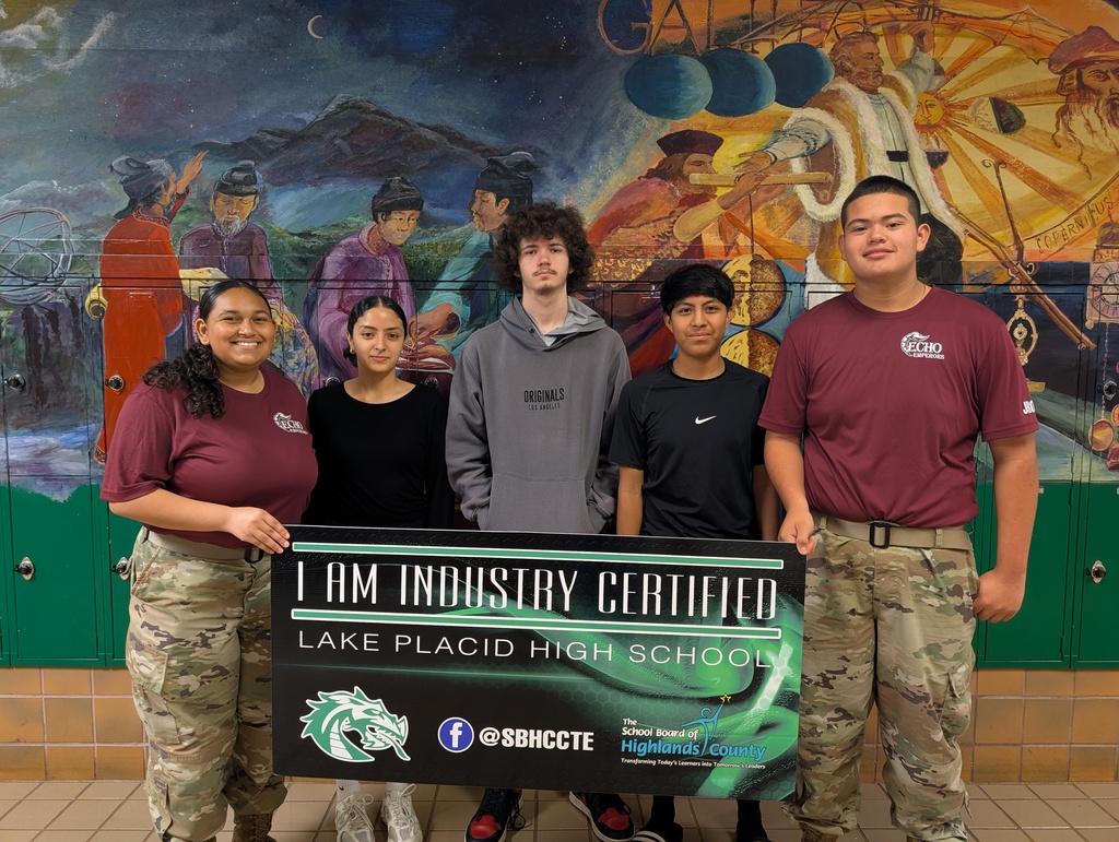 Students holding certificate.