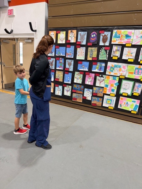 CTE students and families visit the School Board of Highlands County Art Show at SFSC. 