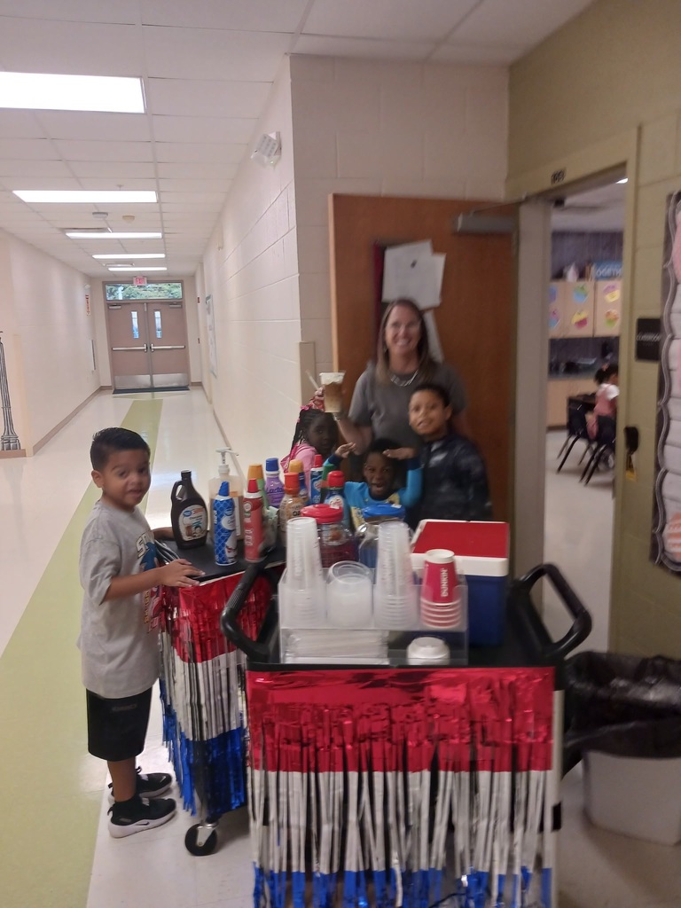 MES Students delivering coffee cart to MES Staff.
