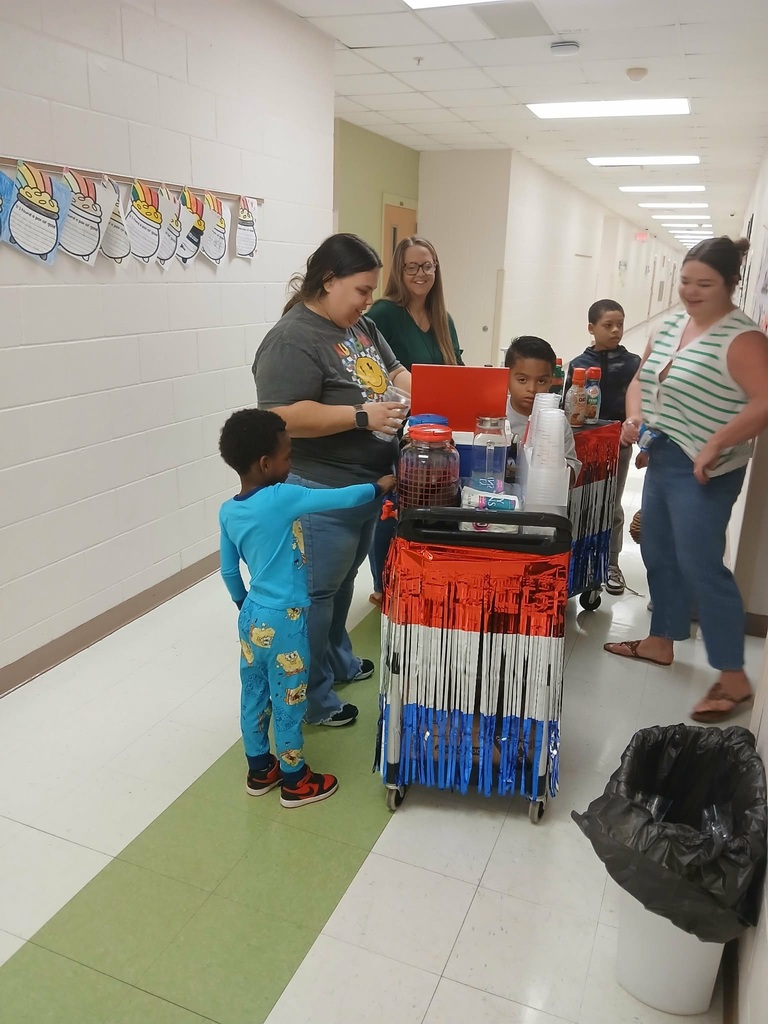 MES Students delivering coffee cart to MES Staff.
