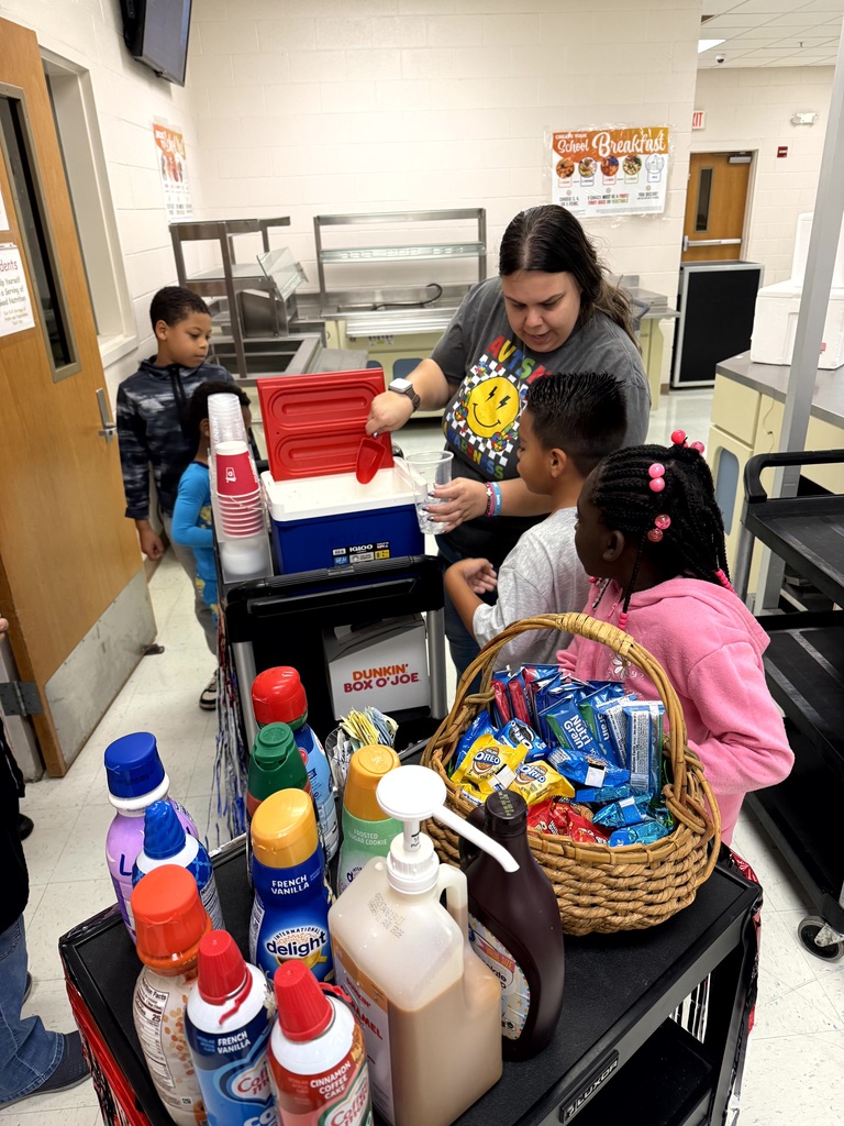 MES Students delivering coffee cart to MES Staff.