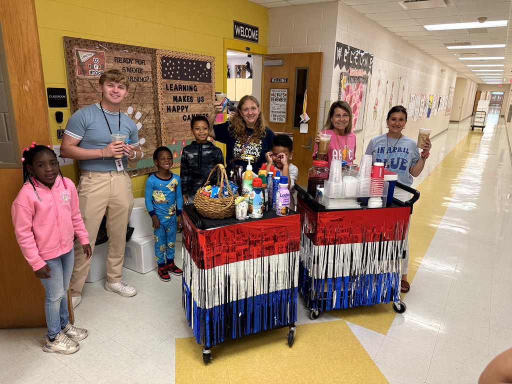 MES Students delivering coffee cart to MES Staff.