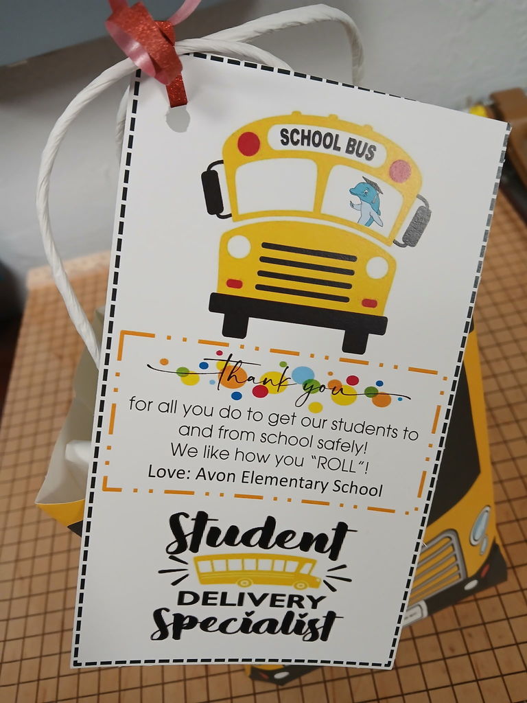AES Bus driver with goodie bag for Bus Driver Appreciation day 2026. CLose up of the poem and tag on the bag. 
