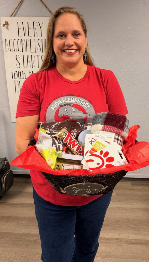 Mrs. Cornell with a lovely basket of goodies from staff. 