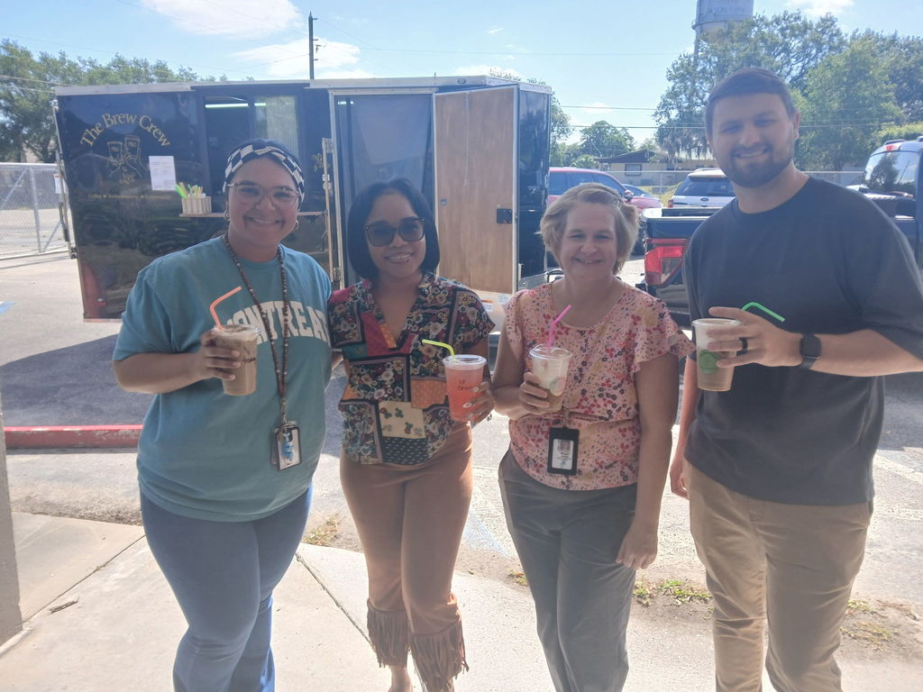 AES Staff with their treat from the Brew Crew truck. 