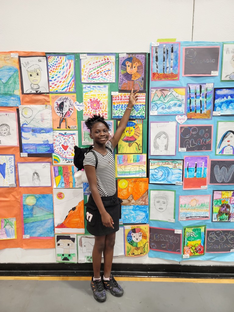MES students and Art Teacher Mrs. Sutermeister at the District Art Show for awards and showcase of all of the MES Artwork.