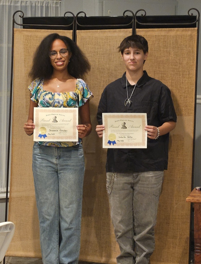 Students holding certificate.