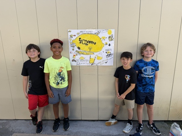 Mrs. Jones’ 3rd grade class recently finished reading The Lemonade War and brought the story to life by creating their very own lemonade stands! Students worked hard designing creative displays, developing presentations, and serving up delicious lemonade for staff and visitors to enjoy.