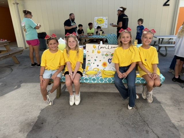 Mrs. Jones’ 3rd grade class recently finished reading The Lemonade War and brought the story to life by creating their very own lemonade stands! Students worked hard designing creative displays, developing presentations, and serving up delicious lemonade for staff and visitors to enjoy.