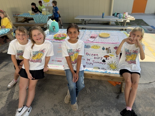 Mrs. Jones’ 3rd grade class recently finished reading The Lemonade War and brought the story to life by creating their very own lemonade stands! Students worked hard designing creative displays, developing presentations, and serving up delicious lemonade for staff and visitors to enjoy.