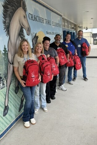 A huge THANK YOU to our local Coca-Cola representative, Amanda Helms , and our local Walmart representatives Chris Acosta and Ruth Pederson for their generous donation of Coca-Cola backpacks filled with school supplies from Walmart!