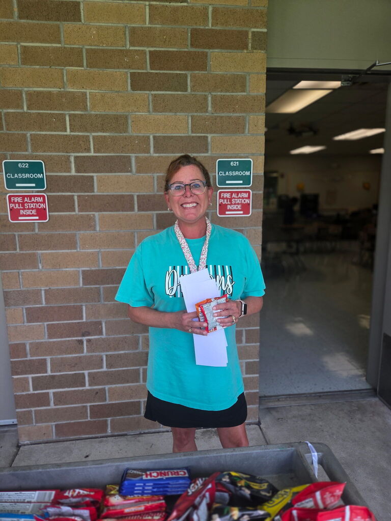 Mrs. Jury holding a treat from the Dragon Wagon.