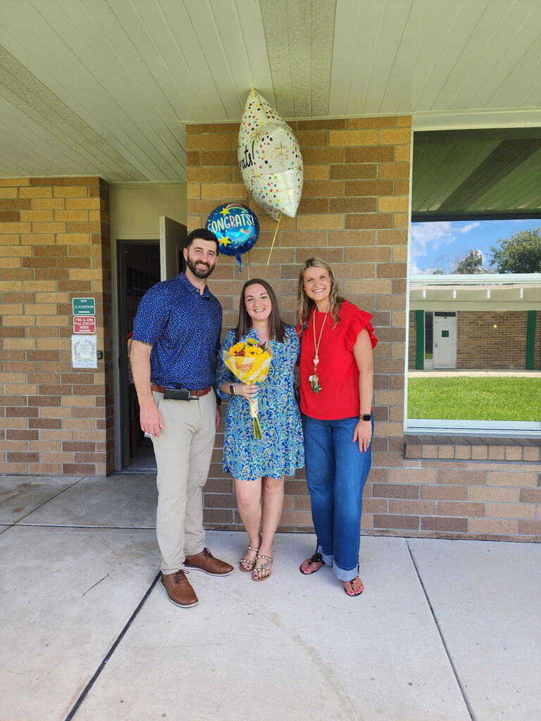 Picture of Mr. Hoffner, Mrs. Lanier and Mrs. Floyd, celebrating Mrs. Lanier winning Teacher of the Year.