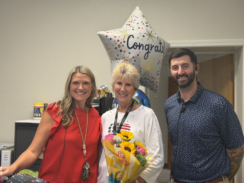 Picture of Mrs. Floyd, Ms. Cruz and Mr. Hoffner celebrating Ms. Cruz winning School Related Employee of the Year.