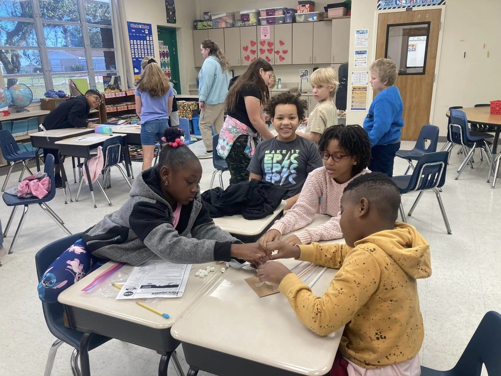 Students completing in a STEM challenge