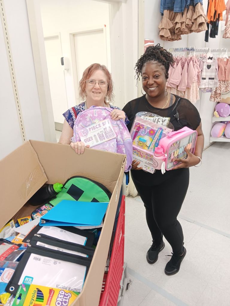2 Teachers with classroom supplies