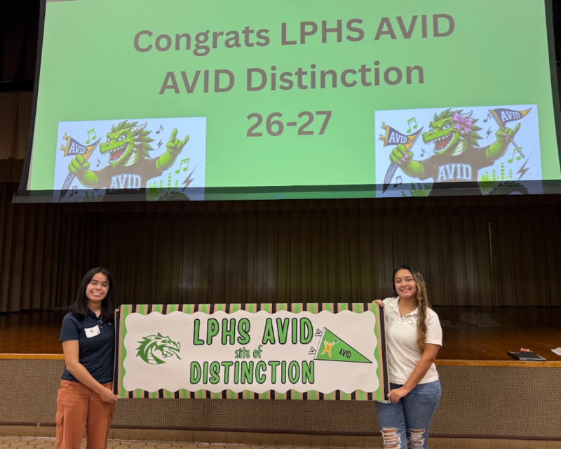 Avid Students holding banner at celebration "site of Distinction"