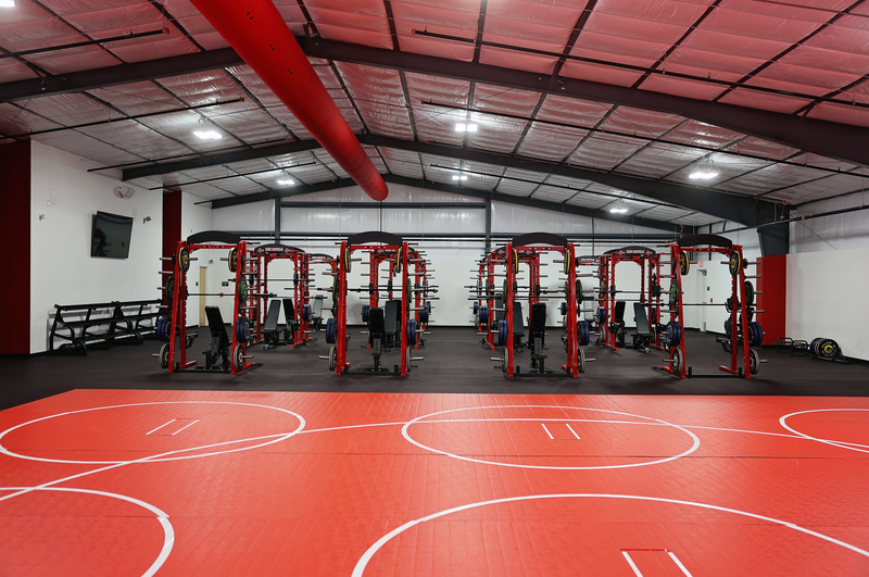 Inside the field house, facing the weight machines