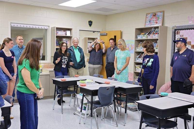 officials in a new classroom