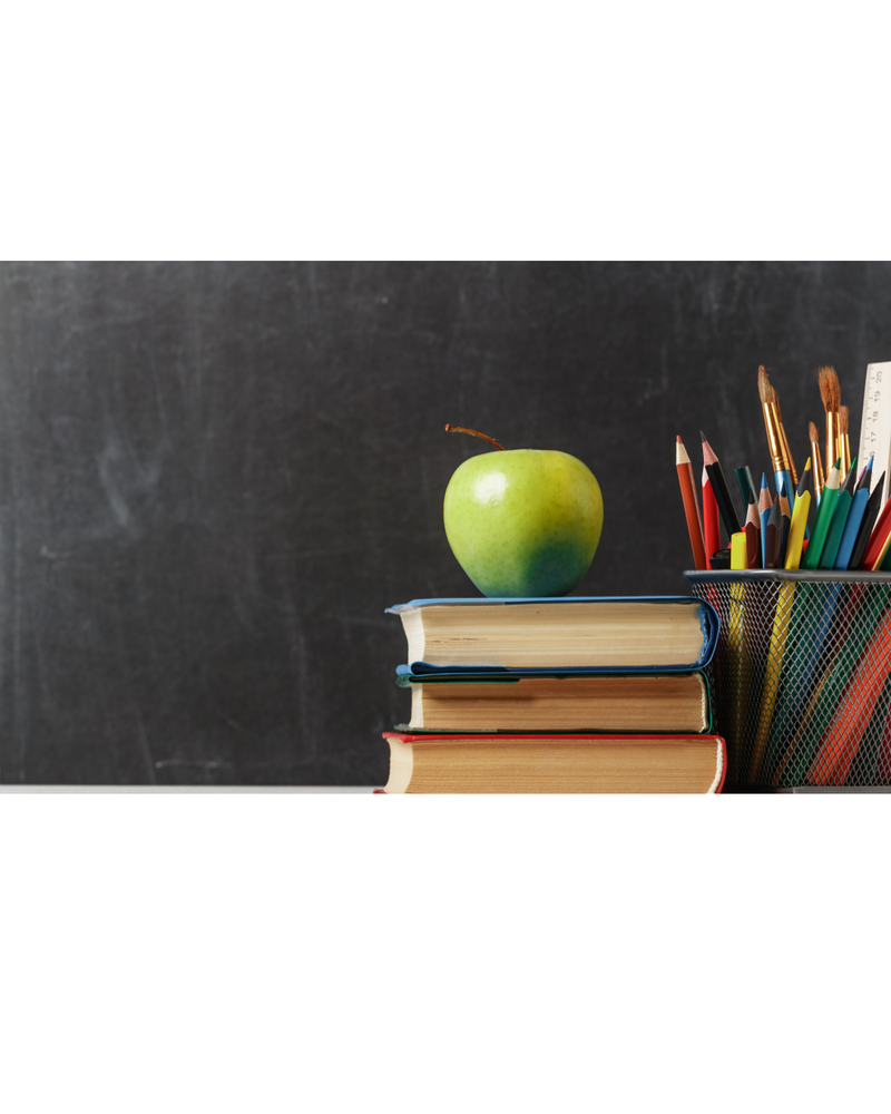 black chalkboard with greeen apple on books sitting in front of it