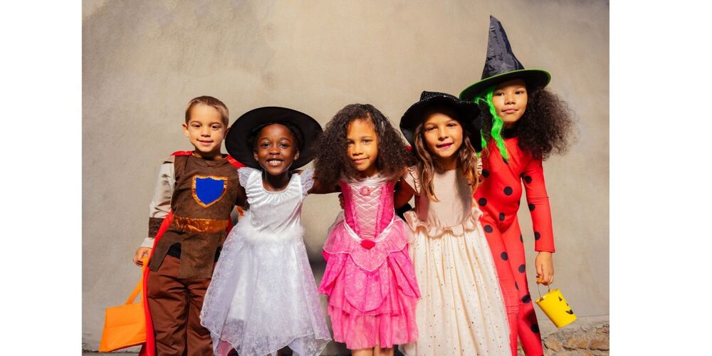 Photo of 5 students in Halloween costumes