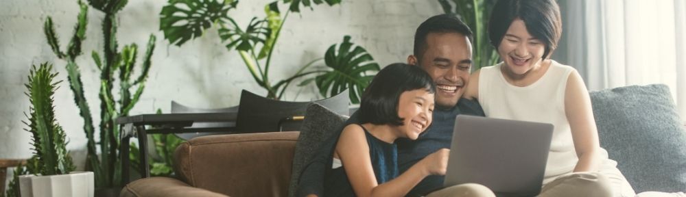 family around a laptop