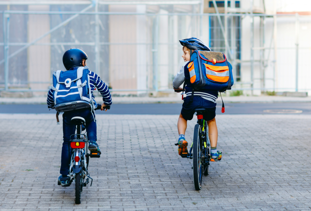 2 kids riding bikes