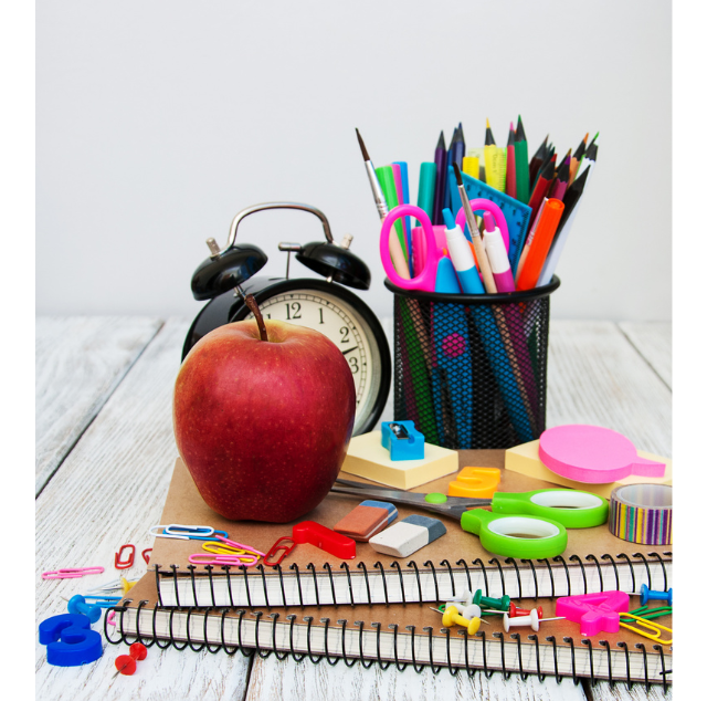 A bunch of school supplies piled up. 