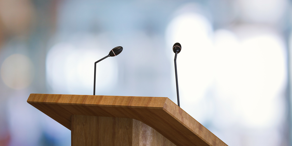 Descriptive image of microphone at podium