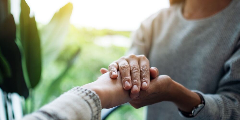 Person holding other persons hand