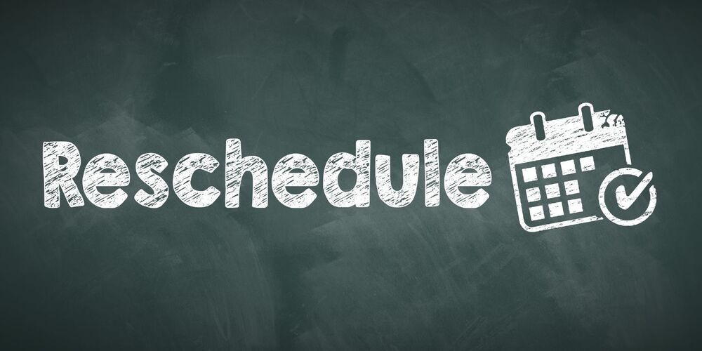 Chalkboard with the word reschedule on it next to image of calendar