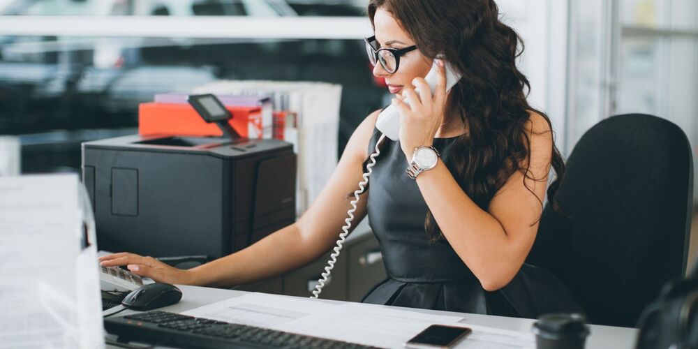 Woman at desk talking on the phone