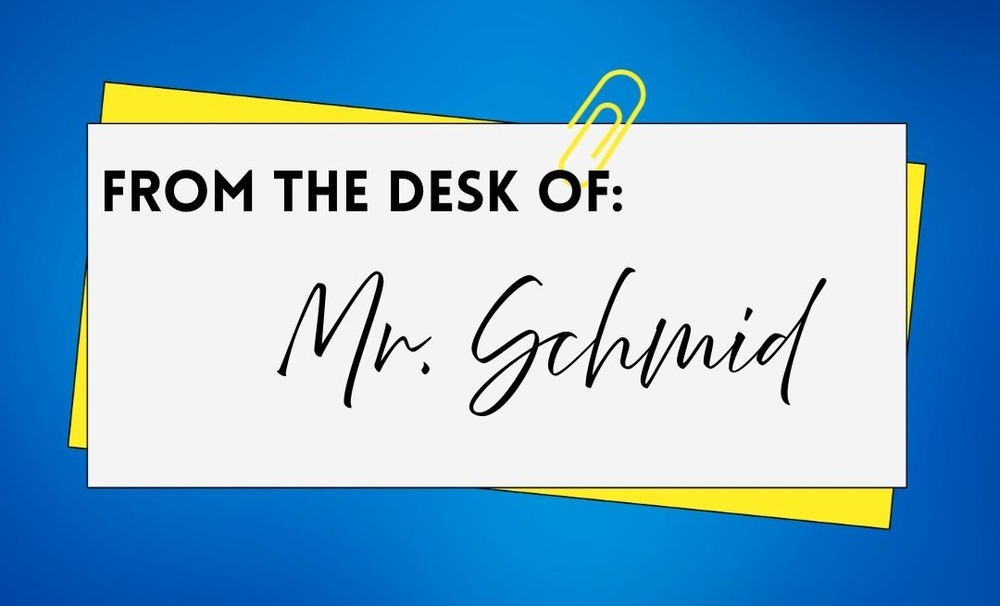 white note with blue background that says from the desk of mr. schmid