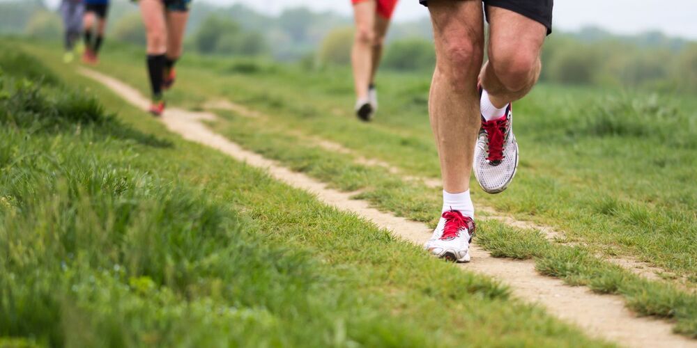 runners legs and feet on a path