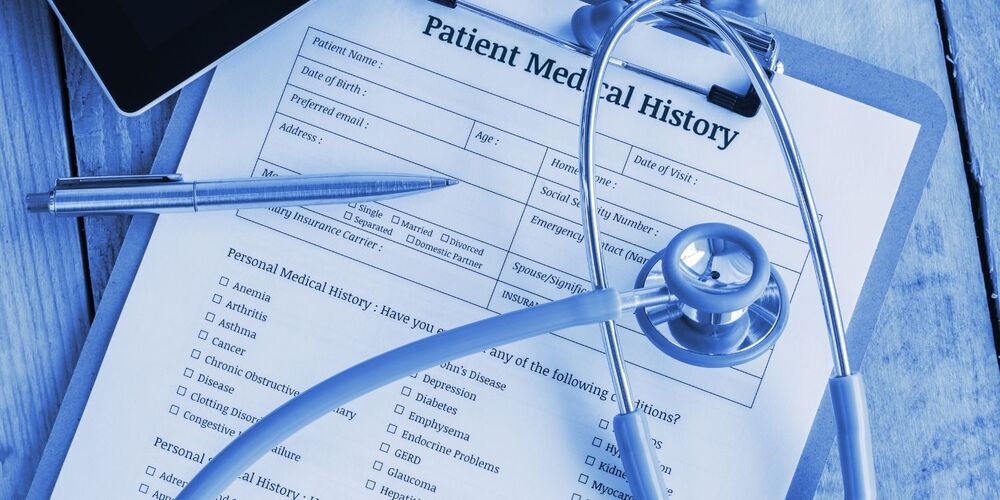 Medical chart with pens and stethescope