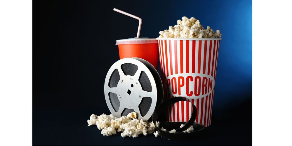 photo of popcorn, a movie reel, and a drink