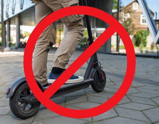 e-scooter with a red strike through it