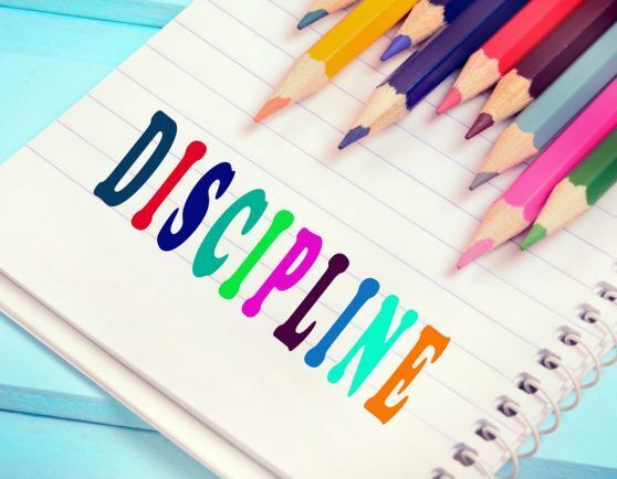 The word "discipline" typed on paper