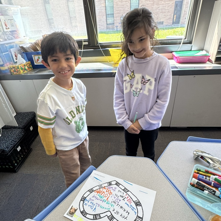 students standing by a compliment mat