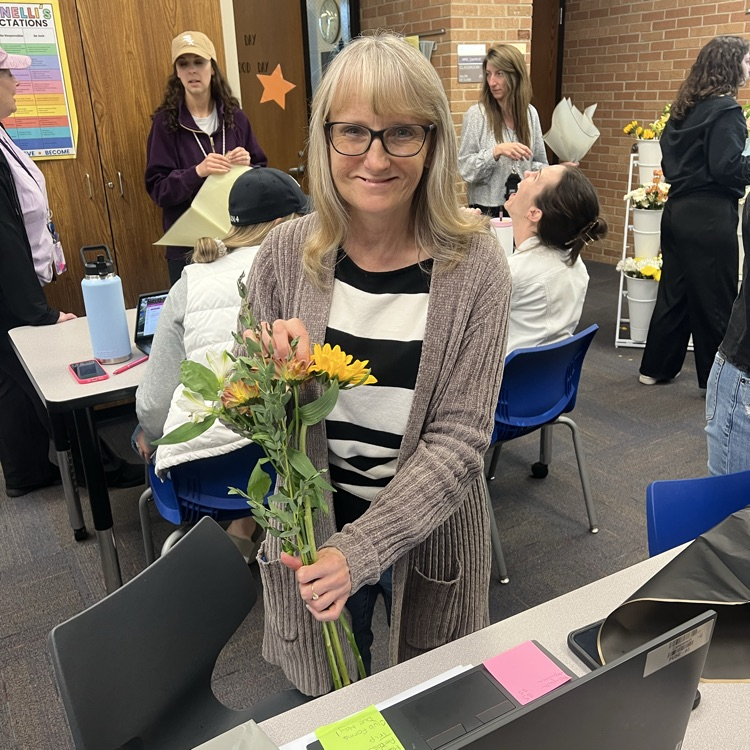 Ms. Schwartz holding her flowers