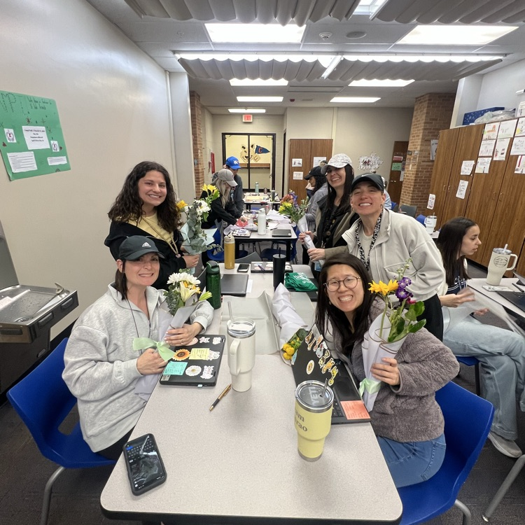 teachers showing their flower bouquets 