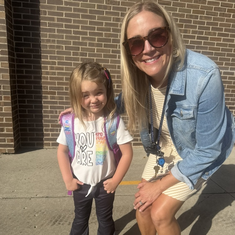 Mrs. Dean with a kindergarten student on the first day of school.