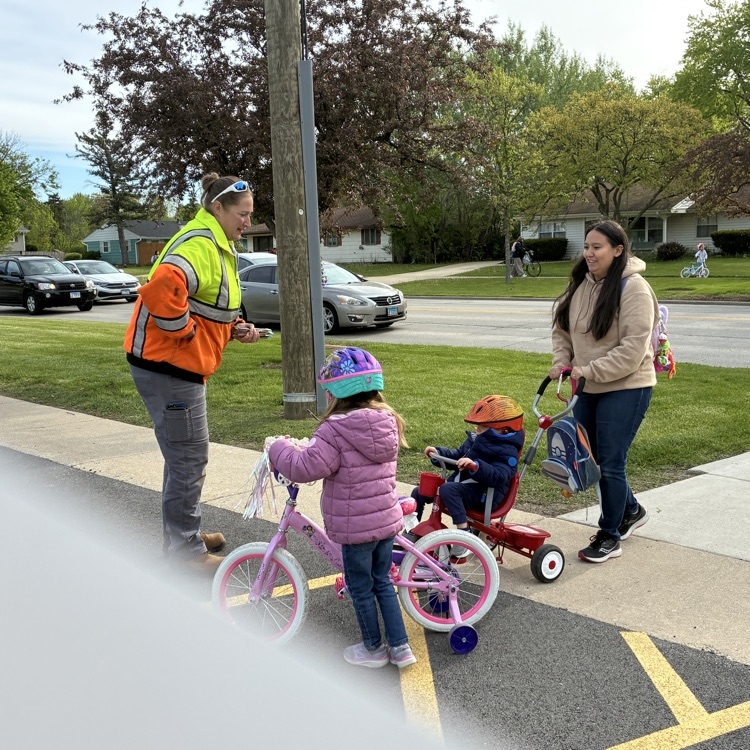 students getting a pencil for biking to school 