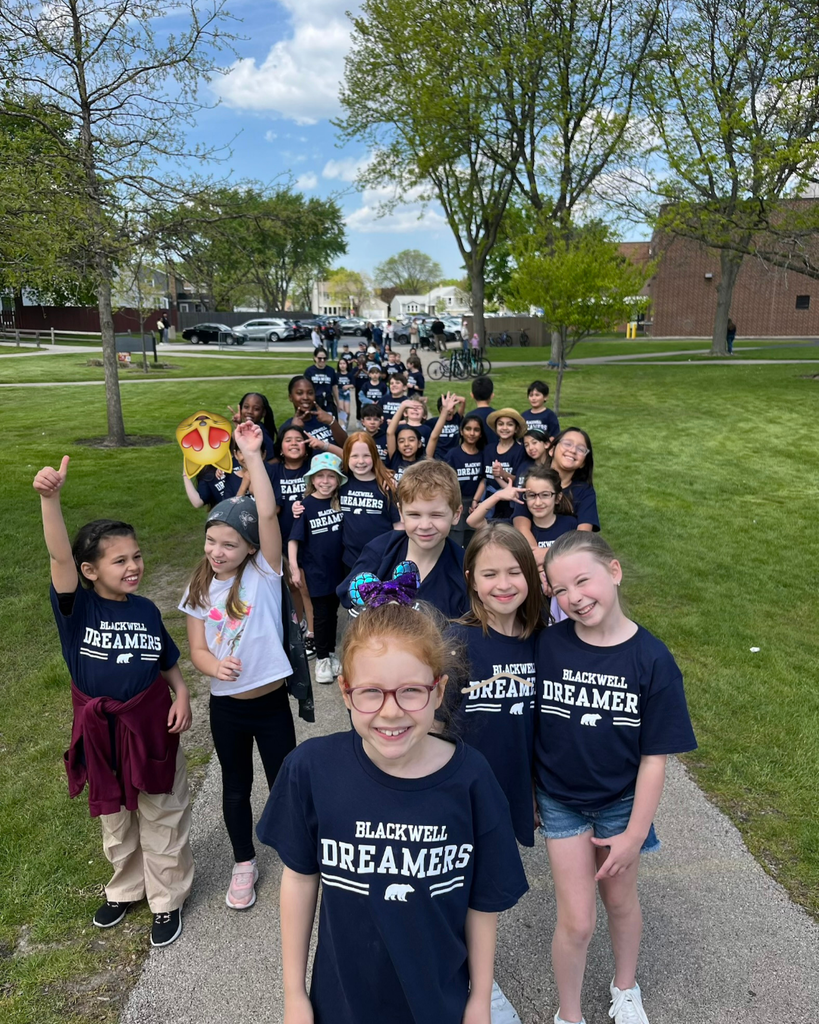 student smiling outside on a walk together