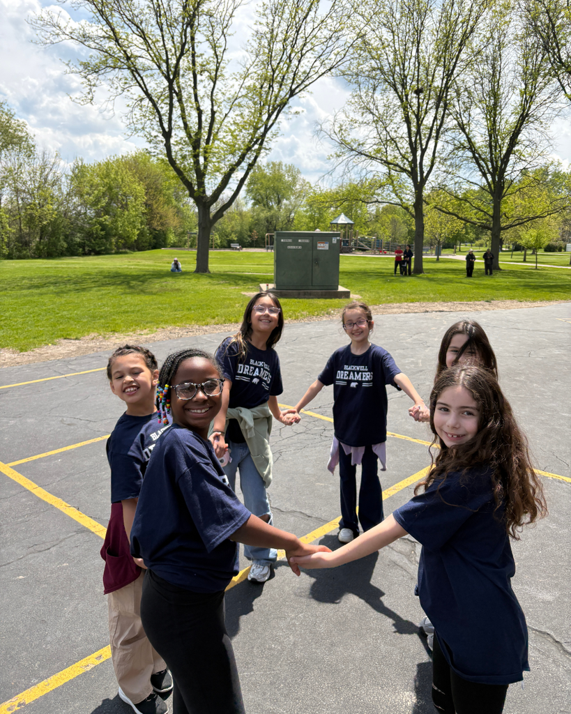 student smiling while dancing in a circle