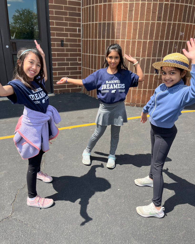 student smiling while dancing