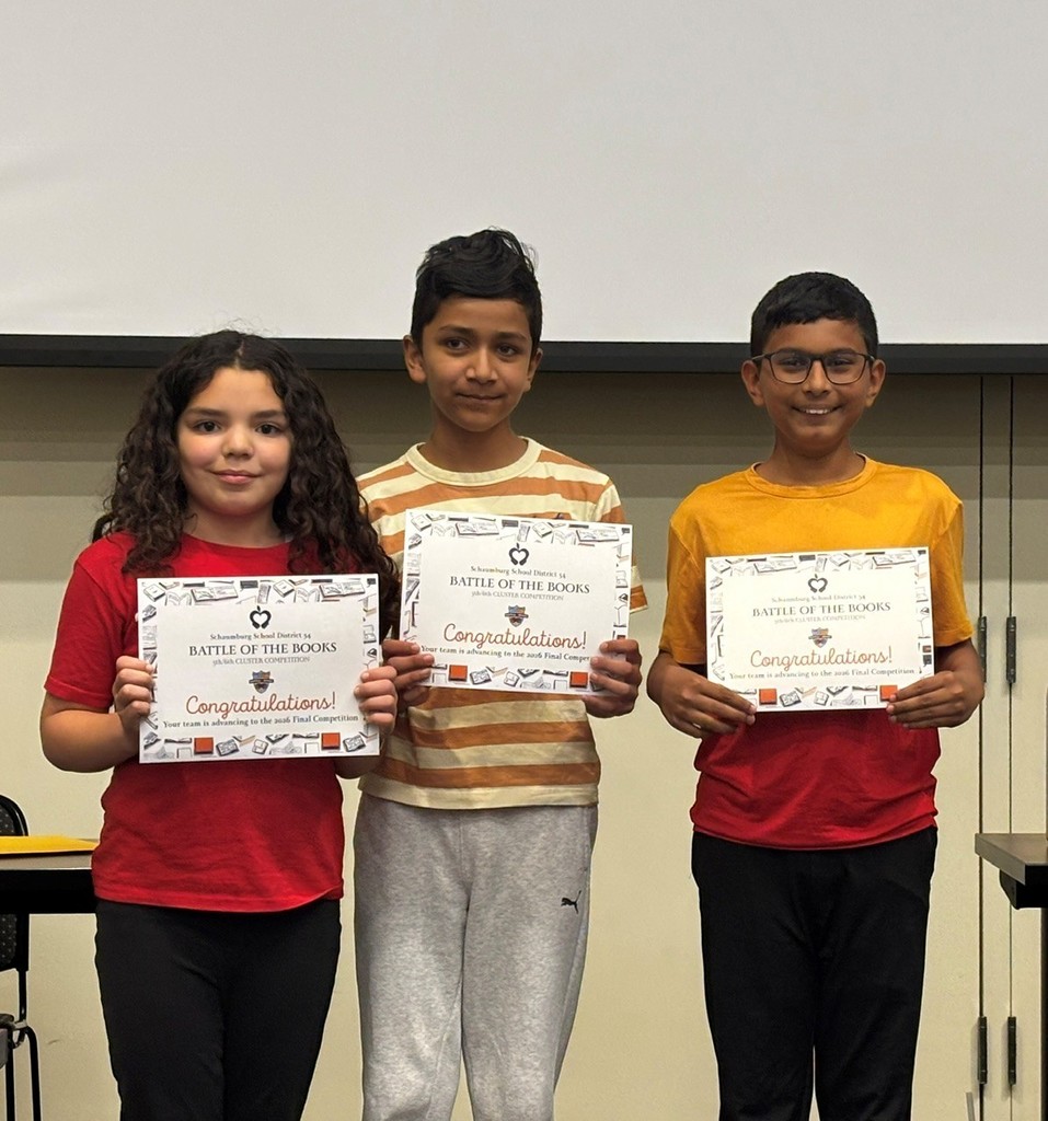 Sixth grade students holding Battle of the Books certificates